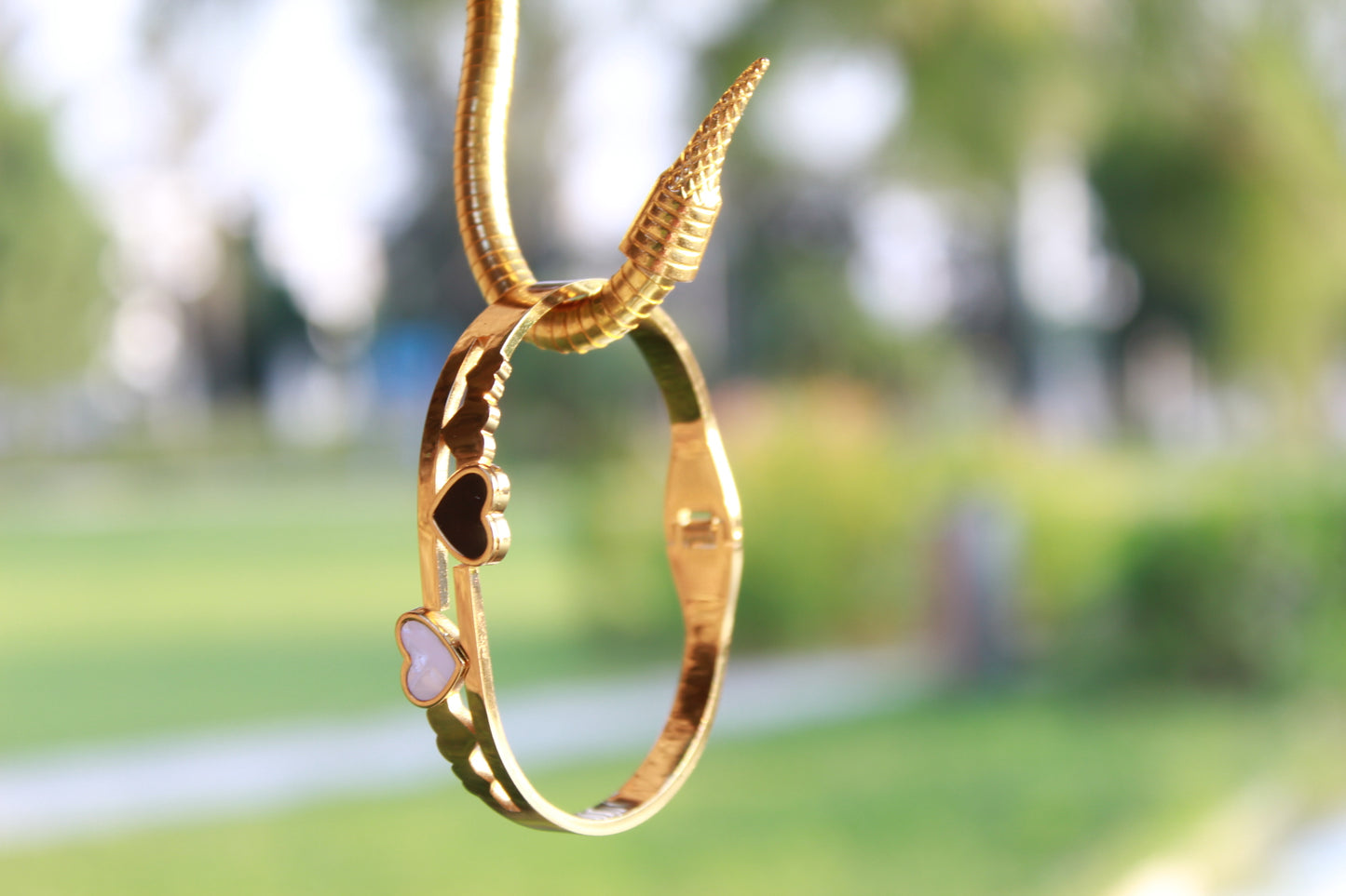 DUAL HEART EMBRACE BANGLE